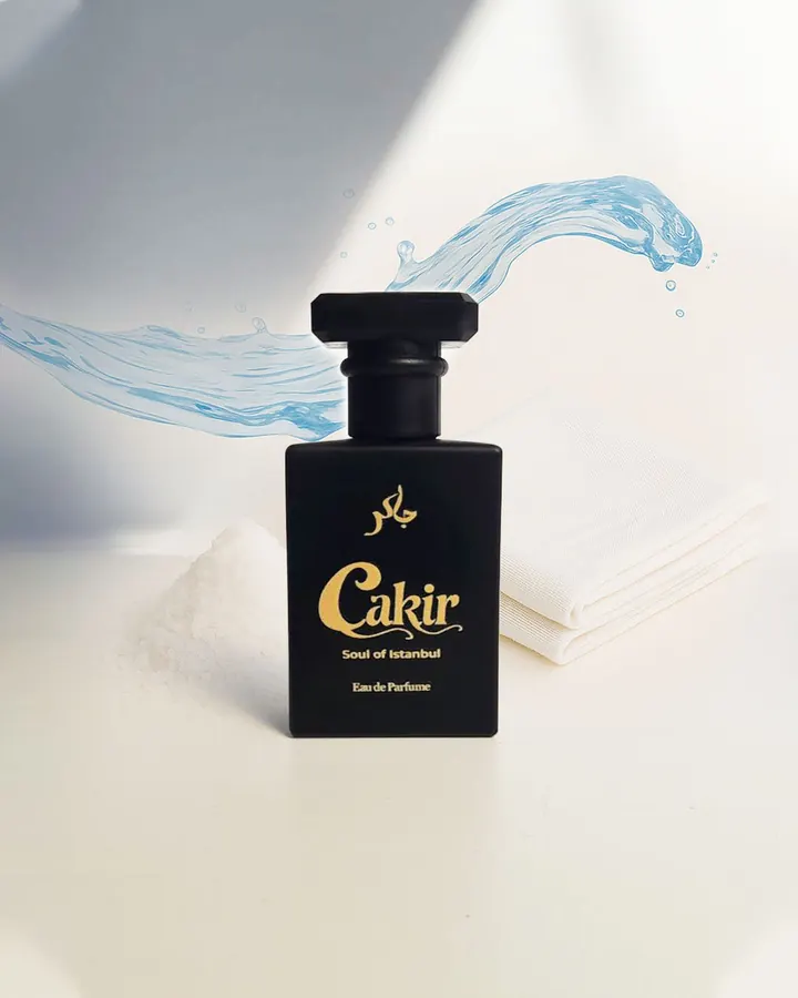Cakir Parfume LOC — black bottle with marine water splash and white linen
